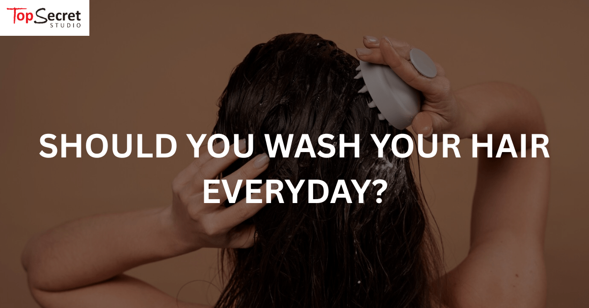 Woman washing her hair with scalp massager